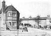 View showing on the right the rear elevation of the cottages on Old Station Square which shows the absence of windows