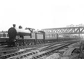 LNWR 4-6-0 Prince of Wales Class No 433 is seen passing beneath the GC bridge on a down parcels express