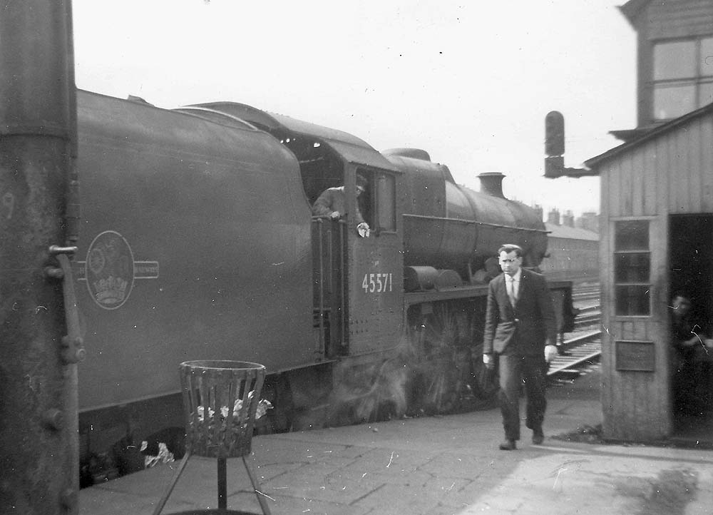 Ex-LMS 4-6-0 5XP Jubilee Class No 45571 'South Africa' pauses at Rugby with a down express service during the summer of 1960