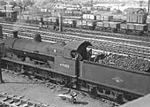 Ex-LNWR 0-8-0 G2a No 49350 is seen on 8th August 1961 shunting in the down yard beneath the footbridge which carried Black Path over the railway