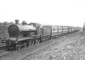 LNWR 4-4-0 Precursor Class No 374 'Empress' is seen with a down Birmingham express circa 1922