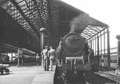 An unidentified ex-LMS 8P 4-6-2 Coronation Class locomotive attracts some admiring glances at the south end of platform 3