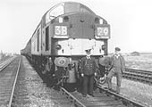 The driver and second man pose in front of an Sulzer Type 4 locomotive on Car Transport Train
