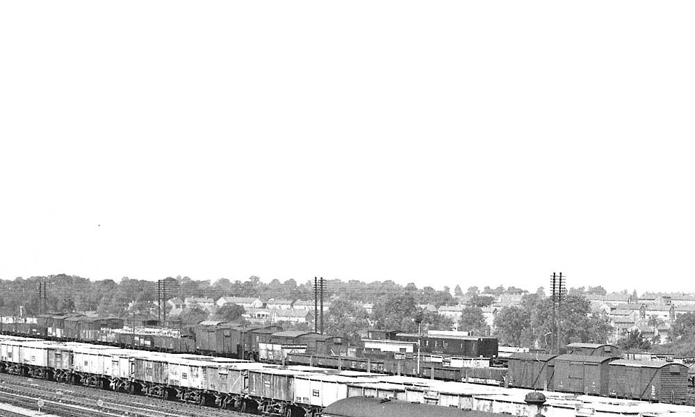 Close up showing two rakes of British Railways 16 ton steel mineral wagons stabled adjacent to the Goods and the Loop lines