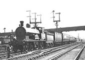 An unidentified LNWR 4-4-0 'George the Fifth' class locomotive on a down Class 2 ordinary passenger service