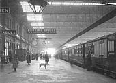 A late Victorian view of the down platform with an important express service waiting to depart to the north