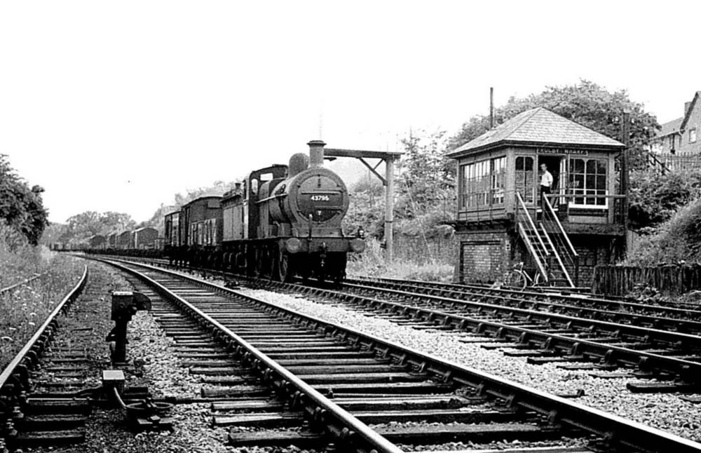 Ex-MR 0-6-0 No 43795 heads a Class K pick up freight service past the ex-Midland Railway signal box at Rugby Wharf on 19th July 1955