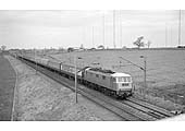 An unidentified British Railways Class AL3 passes Hillmorton, near Rugby, with an up express in March 1967