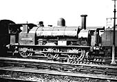 Ex-LNWR 0-6-0ST Crewe Special Tank Carriage Depart No 1 is seen standing outside Rugby shed in the 1950s