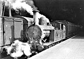 Ex-LNWR 2-4-2T No 6683 is seen in a very poor state standing in one of Rugby's bay platforms with a local passenger service