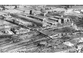 A panoramic aerial view of the approach into Rugby of the Leicester line, the exchange sidings and the goods yard in 1930