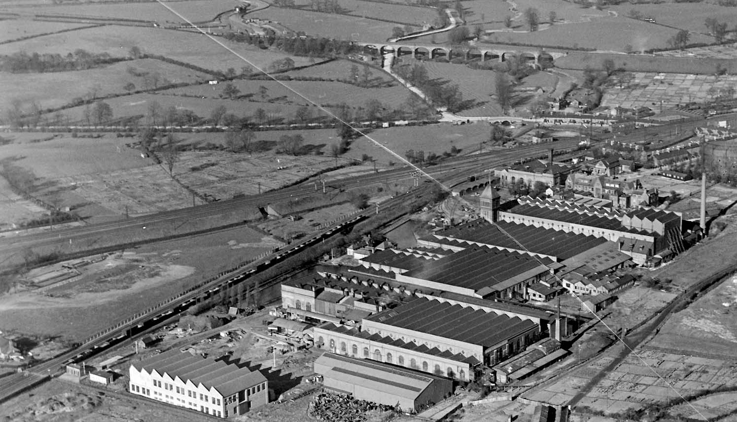A panoramic aerial view of the sidings in front of Willans and Robinson's Victoria Works and the Trent Valley lines behind