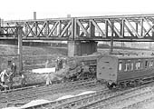 Ex-LMS 4-6-0 Black 5 No 44716 is seen lying derailed under the GC bridge on the down line from Euston