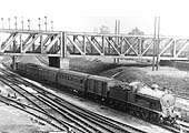 Ex-LNWR 4-6-0 Prince of Wales class No 5831 passes under the GC bridge at the head of a short passenger train