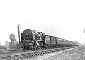 LMS 4-6-0 Royal Scot class No 6126 'Royal Army Service Corps' is seen at the head of an up express near Newbold troughs