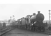LMS 4-4-0 CompoundNo 1107 pilots an unidentified ex-LNWR 4-6-0 Claughton on a down express arriving at the station