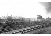 LMS 4-6-0 Royal Scot class No 6102 'Black Watch' in original condition on an up express leaving the station