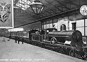An official postcard of a LNWR 4-4-0 locomotive on an up Manchester to Euston express dated November 1904