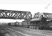 LNWR 0-8-0 G1 thought to be No 1746 is seen passing under the GC bridge on an up goods train