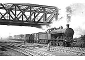 LNWR 0-8-0 G1 class No 2296 is seen passing under the GC bridge on a long up goods train