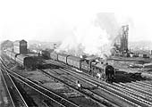 Ex-LMS 4-6-0 Patriot class No 45506 'The Royal Pioneer Corps' heads past the coaling tower at the head of an up express 