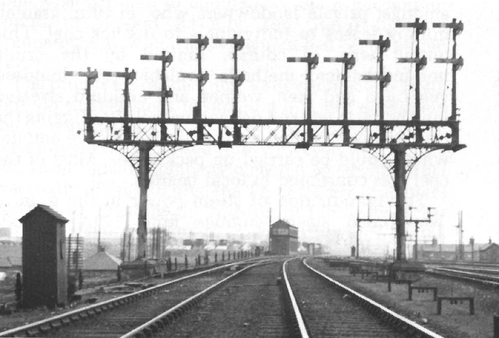 View of the northern approach to the station with the gantry controlled by Rugby's original No 7 signal cabin