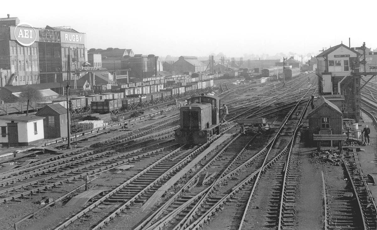 Looking south from the wooden bridge towards the station with Rugby's No 5 signal cabin on the right