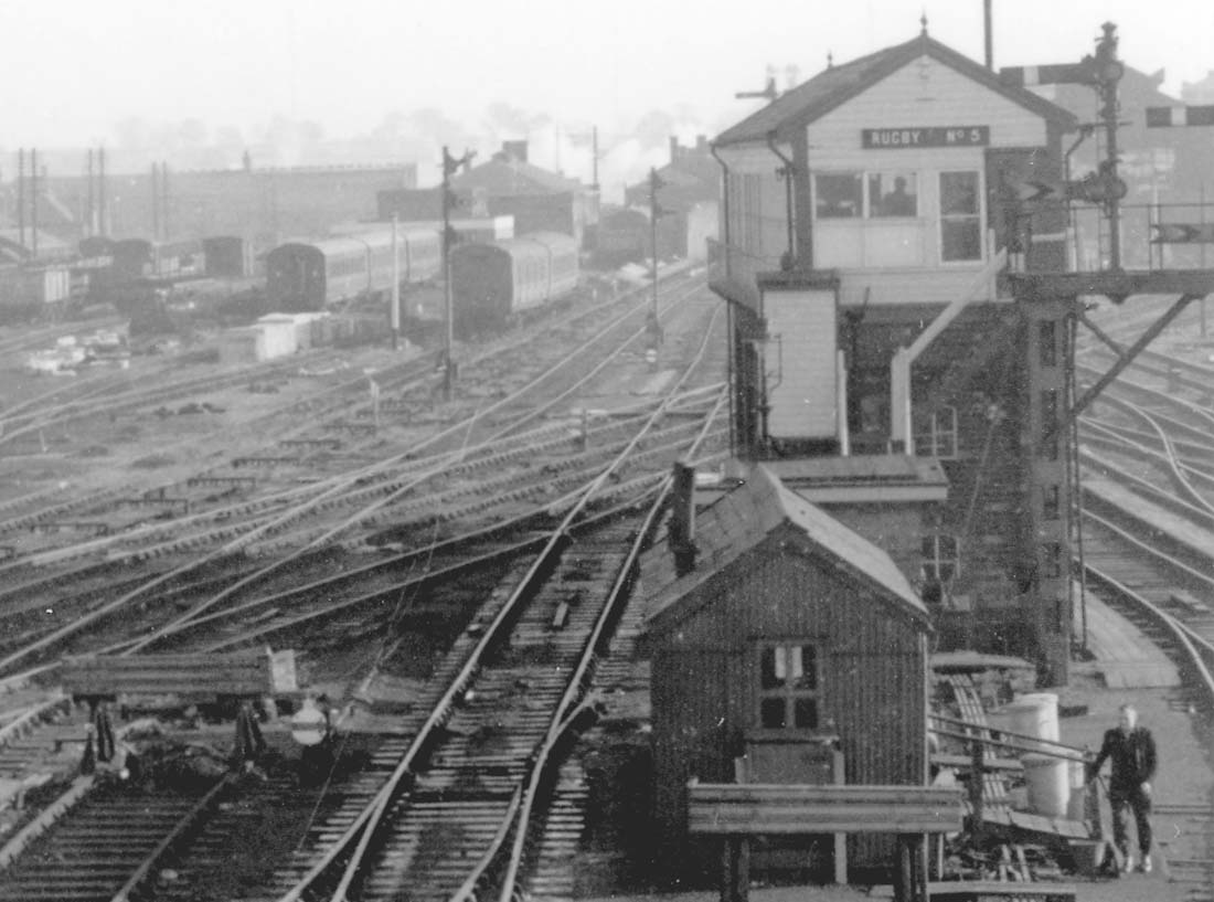 Close up showing Rugby No 5 signal cabin in the foreground and the signal works in the background