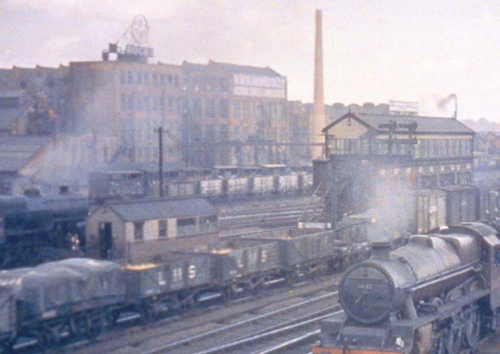 Close up showing in colour Rugby's No 5 signal cabin, the BTH factory and the surrounding railway scene