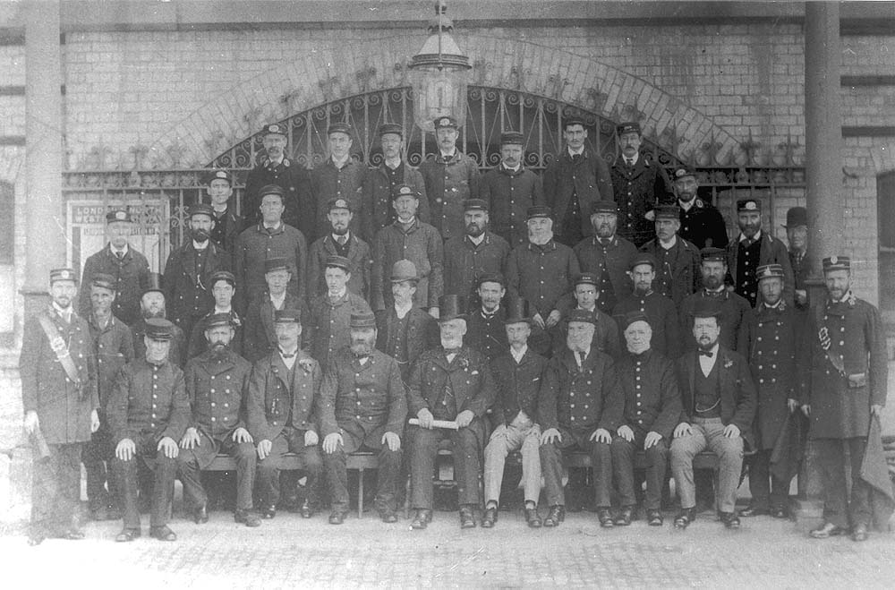 A posed photograph of the full compliment of L&NWR station staff at Rugby's 1885 station