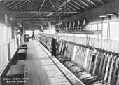 The interior of Rugby's No 1 Signal Box with two signalmen in attendance - each being responsible for a section of levers etc