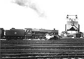 Ex-LMS 4-6-0 Jubilee class No 45637 'Windward Islands' at the head of an up express passes Rugby's coaling tower