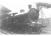 Ex-LNWR 4-4-0 3P Precursor class No 5300 'Hydra' is seen standing at the head of a down local passenger train