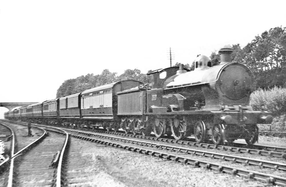LNWR 4-4-0 George V Class No 2370 'Dovedale' approaches Shilton at the head of the up Irish Mail service circa 1922