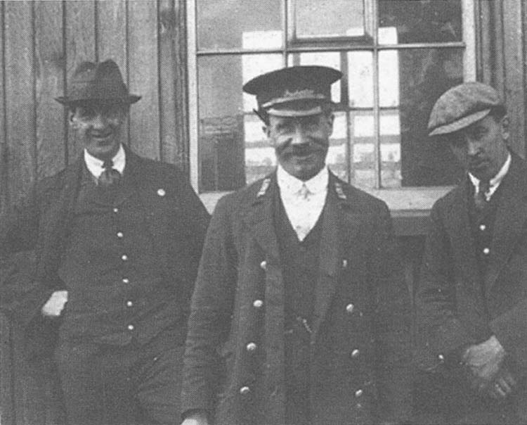 Three members of Three Spires Junction staff pose for the camera, A Dalby, Yard Inspector J Lissaman and E Randle