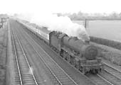 Ex-LMS 5XP 4-6-0 Jubilee class No 45723 'Fearless' is seen working hard at the head of a down express train on 16th March 1957