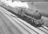 Ex-LMS 5XP 4-6-0 Jubilee class No 45684 'Jutland' is seen with steam escaping from its safety valves at the head of a down express parcels train