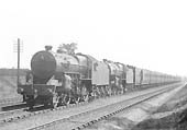 A pair of unidentified LMS 5P4F 2-6-0 'Crabs' are seen at the head of a down excursion train comprised on ex-L&YR coaching stock