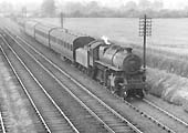 Ex-LMS 4MT 2-6-0 No 43004 is seen at the head of a Stafford to Rugby four-coach local passenger train circa 1955