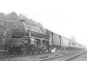LMS 5MT 4-6-0 'Stanier Black 5' No 5349 is seen on a down express as it passes in front of Newbold Trough's water tower