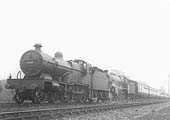 LMS 4P 4-4-0 Compound No 1120 is seen spraying water over 5XP 4-6-0 Jubilee class No 5722 'Defence' as they storm through Newbold Troughs