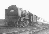 LMS 4-6-0 Royal Scot class No 6157 'The Royal Artilleryman' is seen picking up water whilst at the head of the down Euston to Llandidno express