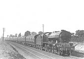 LMS 6P 4-6-0 Royal Scot class No 6115 'Scot Guardsman' is seen in original condition at the head of an up express service