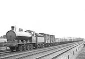 LNWR G1 0-8-0 No 93 is seen approaching Shilton at the head of a long goods train of empty mineral wagons