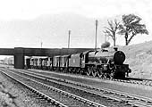 Ex-LMS 4-6-0 Jubilee Class No 45677 'Beatty' is seen heading an up express freight working south of Tamworth