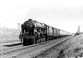 Ex-LMS 4-6-0 Royal Scot Class No 46123 'The East Lancashire Regiment' is seen on a down express service