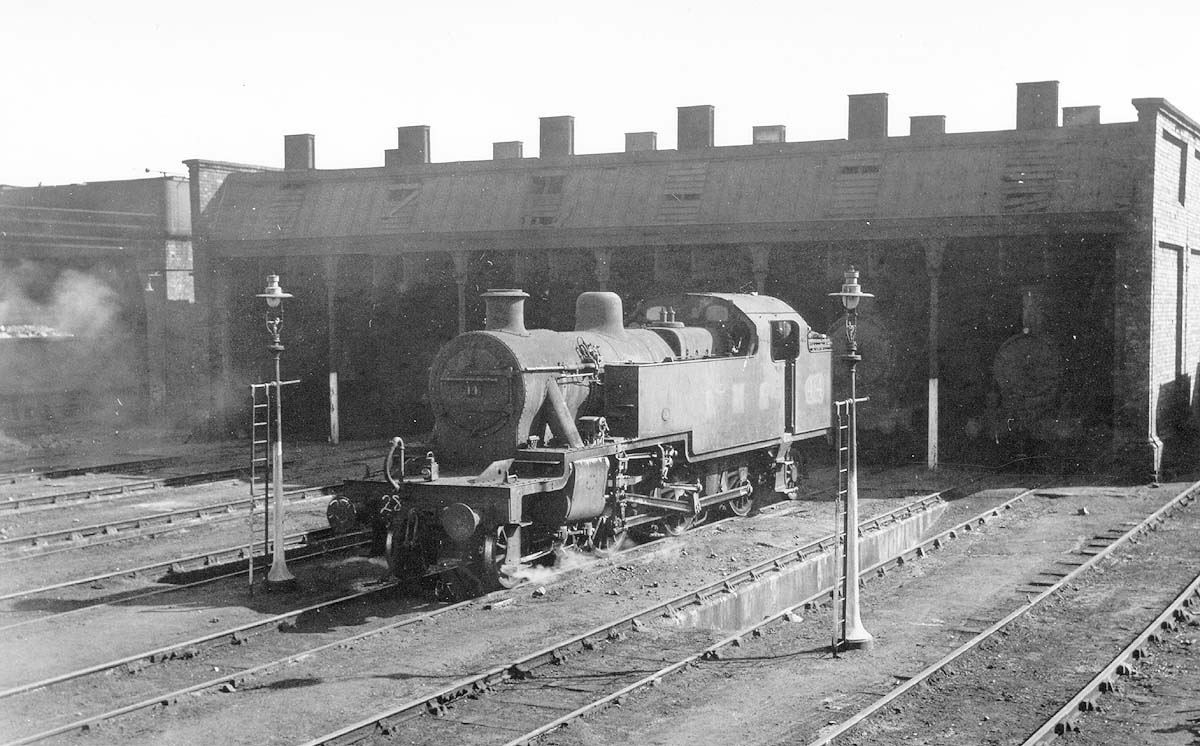 Ex-LMS 3P 2-6-2T No 44 is seen standing on the stabling roads in front of an otherwise empty Milverton shed in May 1948