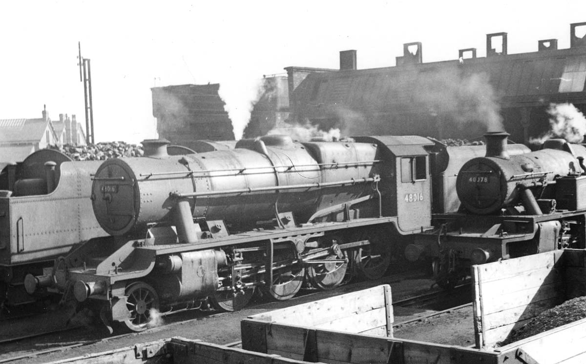 Ex-LMS 8F 2-8-0 No 48016 and ex-LMS 3MT 2-6-2T No 40078 are seen in company with other Warwick allocated locomotives in raising steam