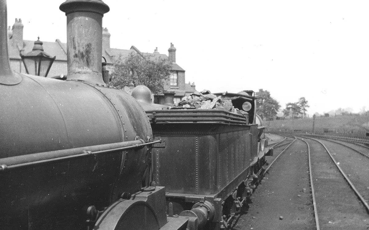 A pair of ex-LNWR 0-6-0 'Cauliflowers', No 8455 and No 8453 are seen standing in line facing the junction with the Leamington to Coventry line circa 1929