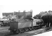 Ex-LNWR 7F 0-8-0 'G2a' No 49452 is seen standing in front of Milverton shed with an unidentified ex-LMS Stanier 2-6-2T on 28th September 1956